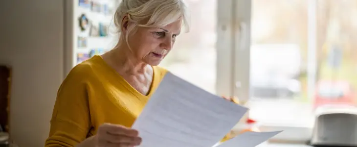 A woman looking over papers
