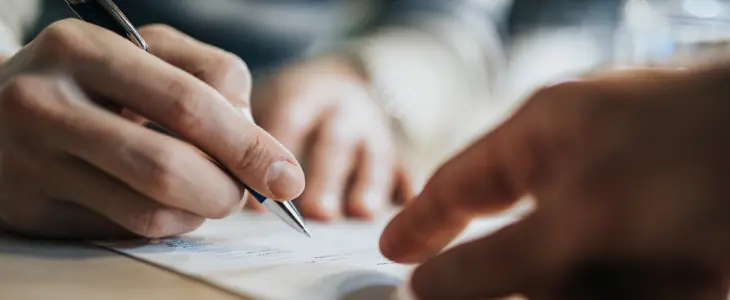 A man signs a trust