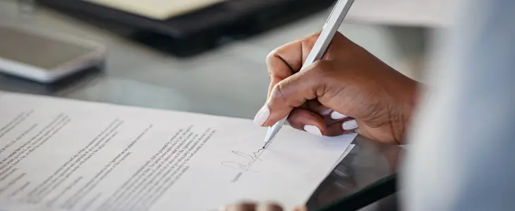 Woman signing a will