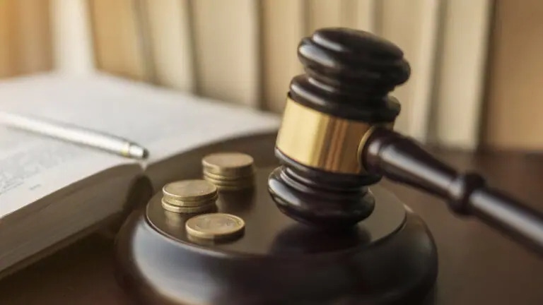 Judge gavel and Euro coins at court.